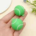 Detailed view of 2-piece green PVC tennis ball charms for DIY sports keychains in hand - Green Tennis Ball (22926)