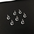 Macro view of seven silver alphabet 'e' pendants with polished mirror finish for DIY jewelry - Letter C