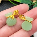Detail of two mini light green faux jade lucky bag pendants with gold tone metal accents - Light Green Glace Zinc Alloy Money Bag (22206)