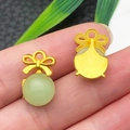 Close-up of matte gold bow charms with green faux jade beads for DIY jewelry making - Light Green Glace Zinc Alloy Butterfly (22205)