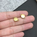 Macro view of two heart-shaped magnetic jewelry clasps in a polished gold finish - Gold Round Shape (19848)