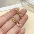 Detail of 18K gold-plated oval link chain earrings held in hand for scale and texture - KC Gold Four-Section Chain (1.4mm Thick, 27x7mm)