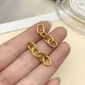 Detail shot of gold four-link chain earrings held by hand over a minimalist background - Gold Four-Section Chain (1.4mm Thick, 27x7mm)