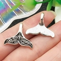 Detail showing front and back of whale tail pendants with retro black oil patterns - Fish Tail Style (22303)