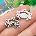 Macro detail of silver crab charms showing intricate textures and hanging ring structure - Crab Style (22301)