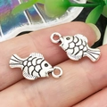 Detail of silver fish charms for DIY jewelry with black scales and hanging rings - Grass Carp Style (22300)