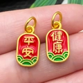 Macro detail of Chinese charms with Peace and Health characters in red enamel - Red Enamel Safe And Healthy Pendant