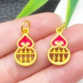Detailed close-up of golden gourd abacus charms with red enamel and intricate metalwork - Red Enamel Gourd Abacus Pendant With Loop