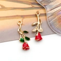 Detailed view of red enamel rose charms with golden stems and green leaves for DIY jewelry - 3D Single Sided Enamel Rose
