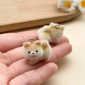 Close-up of adorable flocked teddy dog pendants with soft fur texture and metal rings - White Brown Running Puppy (23140)