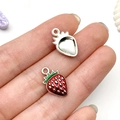Macro detail of strawberry pendants showing red enamel finish and silver metal base - Red Strawberry Style (21923)