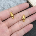 Golden zinc alloy magnetic heart clasp connectors for DIY bracelets shown on palm - Gold Ball Shape (19845)