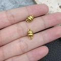 Pair of gold-plated barrel magnetic clasps for DIY jewelry making held by hand - Gold Oval Shape (19855)