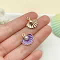 Detail of gold shell pendant with purple enamel and pearl on a sea-themed background - Purple (23196)