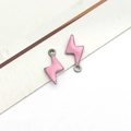 Macro shot of pink enamel lightning bolt pendants with silver edges for jewelry making - Silver Pink