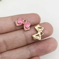 Pink enamel bow pendant with gold metal backing for DIY jewelry making and crafts - Rose Red Bow
