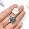 Hand holding silver flower and grey paw print alloy pendants for DIY jewelry making - Black Cat Paw Style (12070)