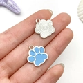 Blue cat paw and silver flower charms displayed on a palm for DIY jewelry making - Lake Blue Cat Paw Style (12071)