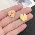 Pink daisy flower pendant with gold back for DIY jewelry shown in hand for scale - Pink Enamel Single Faced Sunflower (12066)