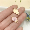 Colgante de piruleta rosa y oro con esmalte y lazo para llaveros personalizados DIY - Piruleta Redonda de Esmalte Rosa (10984)