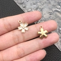White enamel cherry blossom charm with a sparkling crystal center and golden metal finish - White Enamel Rhinestone Cherry Blossom (9922)