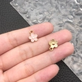 Pink enamel and gold metal flower charms for DIY jewelry making held in hand - Pink Enamel Small Chrysanthemum (12253)