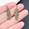 Vintage bronze alloy feather pendants for DIY necklaces and earrings jewelry making - 9x27mm / Antique Bronze Feather Pendant (1423)