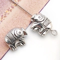 Detailed close-up of antique silver elephant spacer beads with embossed grid texture for DIY - Antique Silver Elephant Spacer Bead (10137)