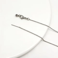 Detail of silver stainless steel bead chain with lobster clasp on a white plate - Antique Silver Bead Universal Chain Style