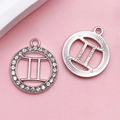 Silver Gemini zodiac pendant with crystal rhinestones and hollow astrological symbol - Gemini