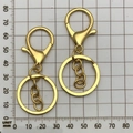 Golden lobster clasp keychain with chain length measurement of 70mm on a grid scale - Gold With Chain (12743)