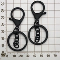 Detailed view of matte black lobster claw keychain with 4-link chain on scale ruler - Matte Black With Chain (12747)