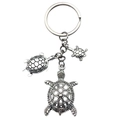 Exquisite silver metal sea turtle keychain pendant featuring three turtles on a white background - Antique Silver Turtle