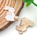 Golden rabbit charm with white enamel bow and faux pearl detail for DIY jewelry - White Enamel Dotted Rabbit (11940)