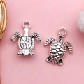 Silver-plated turtle charms showing front and back details for DIY jewelry making - Antique Silver Sea Turtle (8568 - Antique Silver Ocean Turtle 12x19mm - Zinc Alloy - 1.1g)