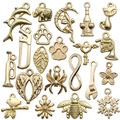 Golden alloy vintage charms set featuring animals plants and symbols for DIY jewelry making - Mixed Styles (SN600)