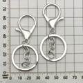 Silver metal lobster clasp keychain with link chain, 70mm length shown on measurement scale - Bright Silver With Chain (12748)