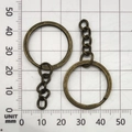 Antique bronze finish DIY metal keychain ring with chain shown on metric scale mat - Antique Bronze 25mm Ring With Chain (13509)