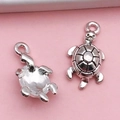 Antique silver sea turtle charm for DIY jewelry with detailed shell texture on pink background - Ocean Turtle (4256)