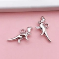 Silver dinosaur T-Rex alloy charms for DIY jewelry making on pink background - Small Dinosaur (B90)