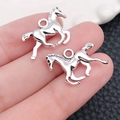 Detailed macro view of antique silver cowboy horse charms for DIY jewelry making - Antique Silver Horse (2321)