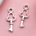 Set of two vintage silver alloy key charms with clover-shaped cutouts for DIY jewelry making - Small Key (6732)
