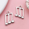 Silver music note charms in metal alloy for DIY jewelry making and craft projects - Music Note Symbol (9162)