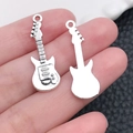 Close-up of silver guitar charms showing detailed fretboard and polished finish - Antique Silver Guitar (10789)