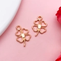 Two rose gold clover leaf charms for DIY bracelets with a hollow heart shaped design - Hollow Four-Leaf Clover (17702)