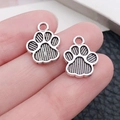 Close-up of animal paw print alloy pendants for DIY necklace jewelry making - Double Sided Paw Print Pendant (17371)