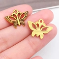 Handheld vintage alloy butterfly charms in gold and bronze finish for DIY jewelry - Dotted Butterfly (10215)