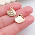 Détail d'un pendentif en alliage en forme de coquillage pour la création de bijoux - Pendentif Coquillage Vague (20711)
