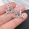 Macro shot of I love Music heart charms in vintage silver alloy for DIY jewelry making - Antique Silver Heart MUSIC Tag (18937)