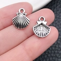 Tibetan silver scallop shell charm pendant for DIY jewelry making held in hand - Marine Shell (11303)